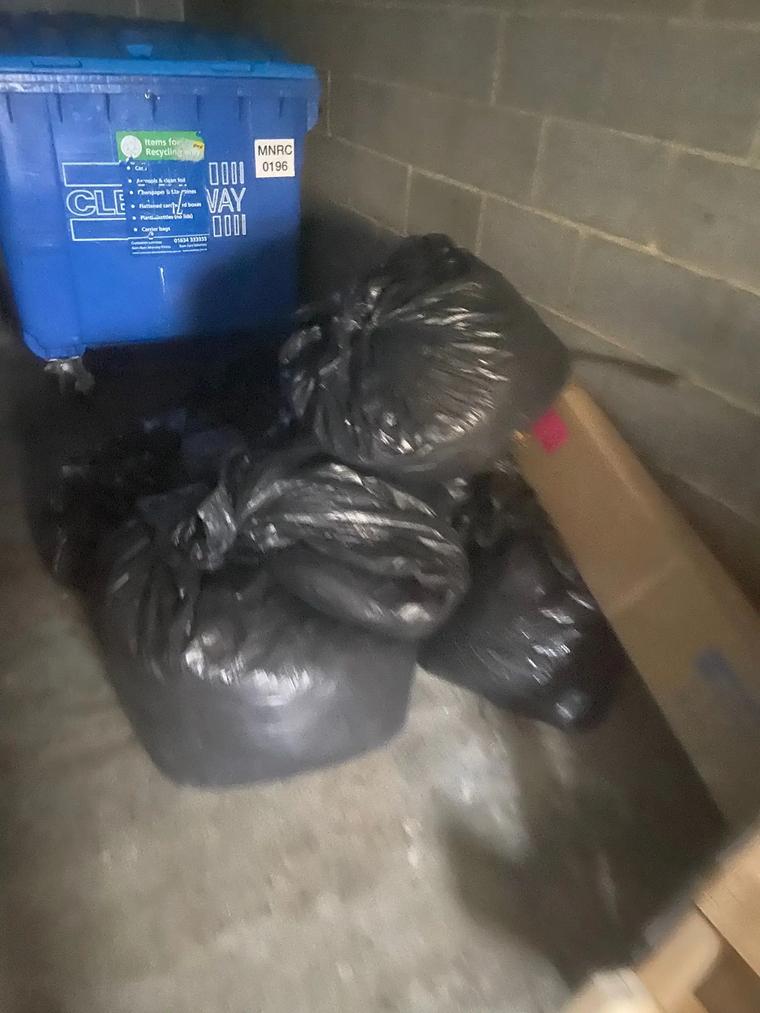 Bagged waste stacked and ready for collection